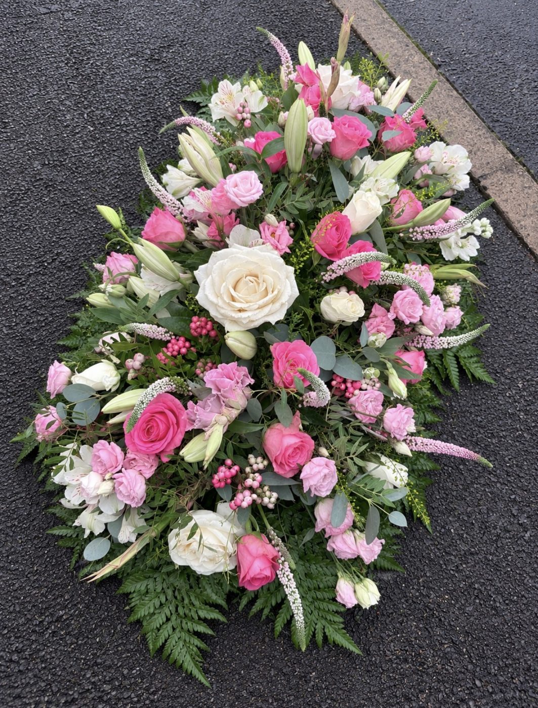 Pink and white funeral spray