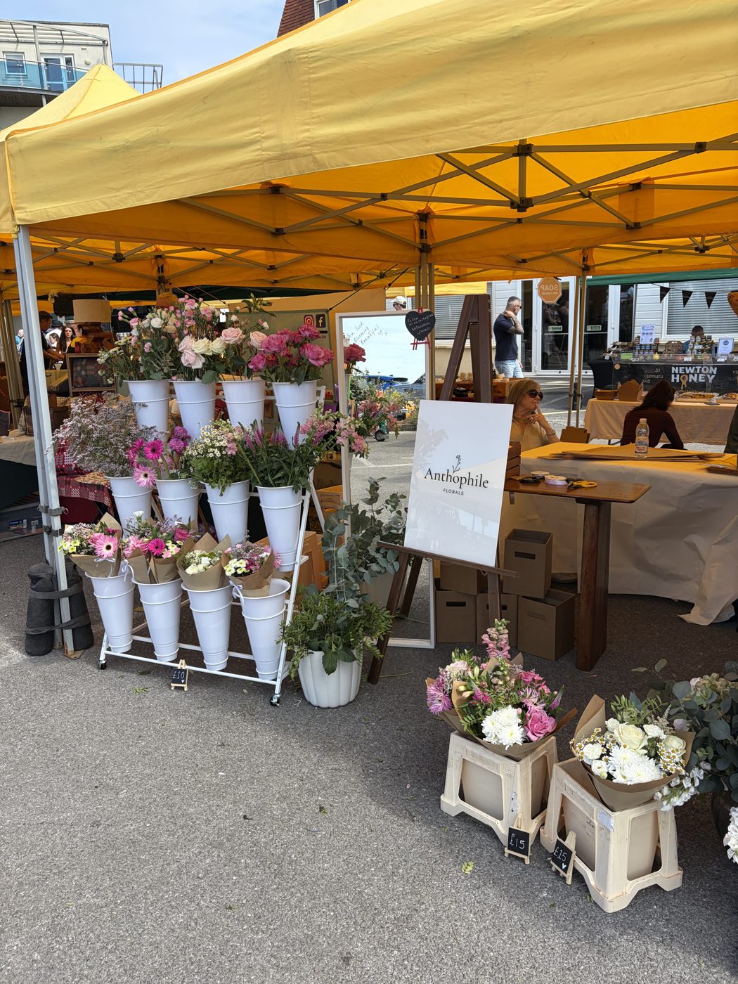 Anthophile Florals market stall with buckets of bouquets
